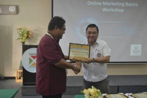 Receiving plaque of appreciation from Mayor John Bongat